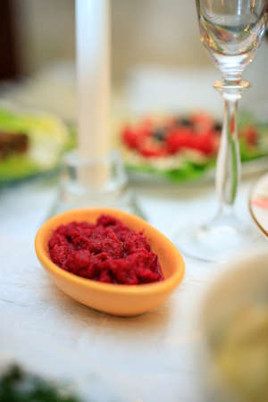 sauce with red horseradish on the festive table.の写真素材