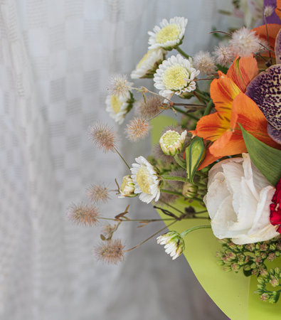 beautiful bright bouquet in a purple basket on a white background, copy space.の写真素材