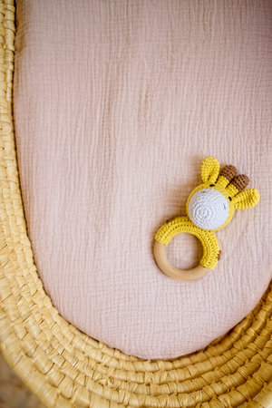 in a basket natural wooden knitted toys for a newborn. View from aboveの写真素材