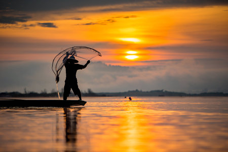 fisherman on boatの写真素材