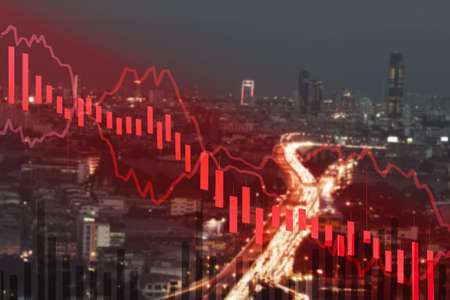 business financial graph, price down trend and cityscape view