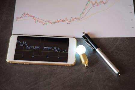 new idea of stock markets graph chart analysis concept, stock chart on smartphone screen with...