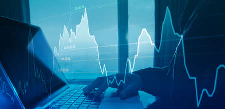 Business people analyzing graph or trading stock exchange by laptop concept
