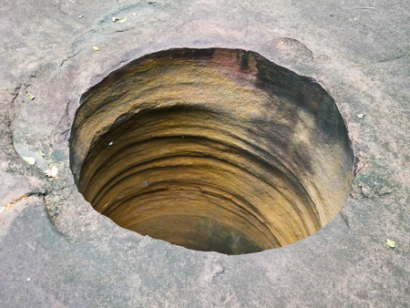 Amazing stone hole the hole is like a pot, is a natural hole.The hole is the largest group in Thailand. There are no less than 16 holes with many sizes ranging from 40 -300 cm wide mouth - 10 m. deepの写真素材