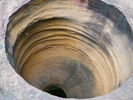 Amazing stone hole the hole is like a pot, is a natural hole.The hole is the largest group in Thailand. There are no less than 16 holes with many sizes ranging from 40 -300 cm wide mouth - 10 m. deepの写真素材