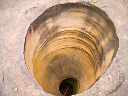 Amazing stone hole the hole is like a pot, is a natural hole.The hole is the largest group in Thailand. There are no less than 16 holes with many sizes ranging from 40 -300 cm wide mouth - 10 m. deepの写真素材
