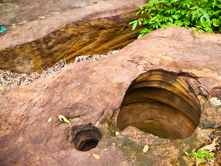 Amazing stone hole the hole is like a pot, is a natural hole.The hole is the largest group in Thailand. There are no less than 16 holes with many sizes ranging from 40 -300 cm wide mouth - 10 m. deepの写真素材