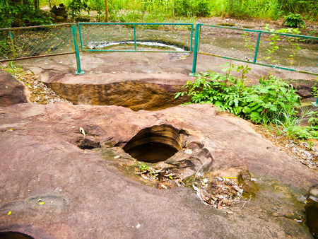 Amazing stone hole the hole is like a pot, is a natural hole.The hole is the largest group in Thailand. There are no less than 16 holes with many sizes ranging from 40 -300 cm wide mouth - 10 m. deepの写真素材
