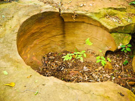 Amazing stone hole the hole is like a pot, is a natural hole.The hole is the largest group in Thailand. There are no less than 16 holes with many sizes ranging from 40 -300 cm wide mouth - 10 m. deepの写真素材
