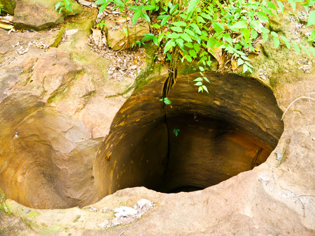Amazing stone hole the hole is like a pot, is a natural hole.The hole is the largest group in Thailand. There are no less than 16 holes with many sizes ranging from 40 -300 cm wide mouth - 10 m. deepの写真素材