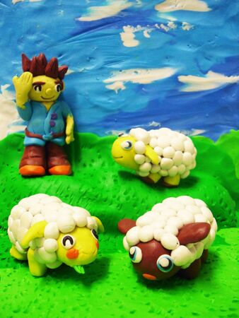 little boy and cheep. cray mould.Shepherd.の写真素材