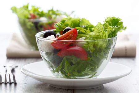 healthy food - salad with mozzarella, arugula and tomatoesの写真素材