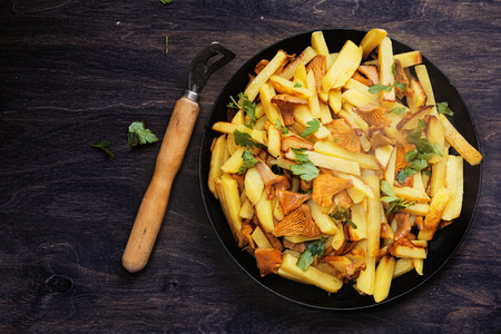 Potatoes with chanterelle roasted on the pan.の写真素材