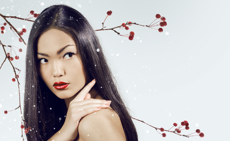 Asian woman beauty face closeup portrait. Beautiful attractive girl with long shiny dark  hairs.の写真素材