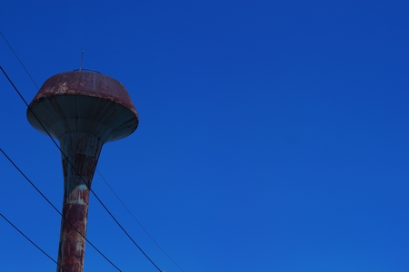 old water tank with the blue skyのeditorial素材
