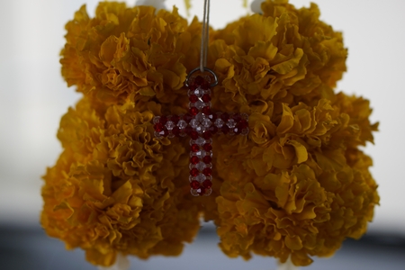 crystal cross with the Marigold flower backgroundの写真素材