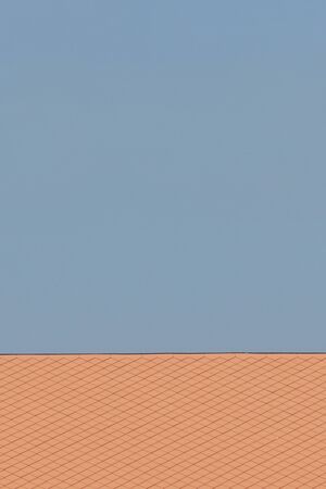 soft brown roof tile with the blue skyの写真素材