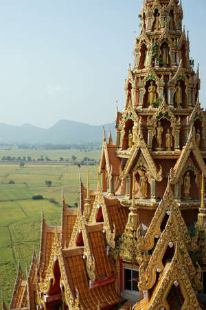 top view of Buddha temple with rice field backgroundの写真素材