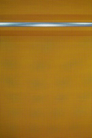 texture of orange fabric with stainless tube for background usedの写真素材