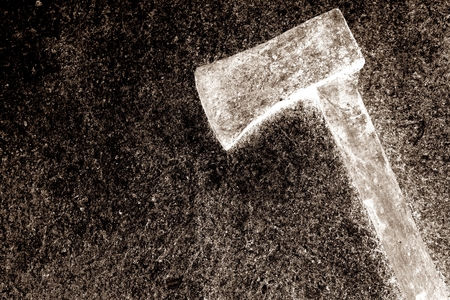 iron axe with wood handle on the concrete backgroundの写真素材