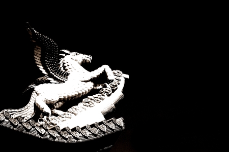 black and white Pegasus sculpture on the rooftopの写真素材