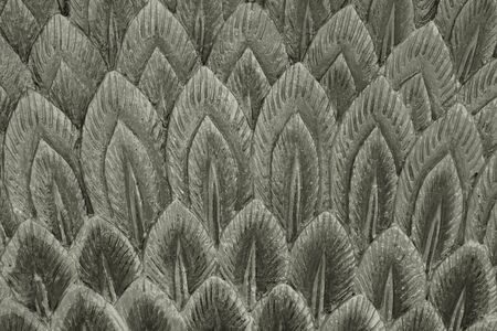 abstract stucco art of peacock feather in spear shape