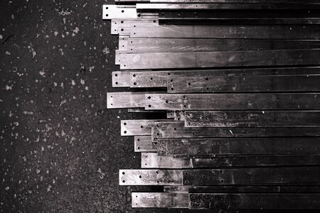 abstract of line up metal slat on concrete floor