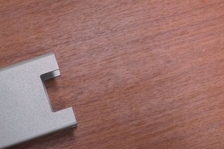 abstract metal U shape on wood board backgroundの写真素材