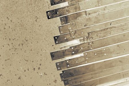 abstract of line up metal slat on concrete floor