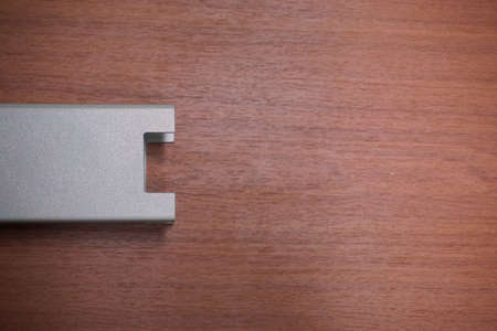 abstract metal U shape on wood board backgroundの写真素材