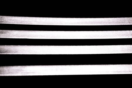 abstract strip of bright line with dark background