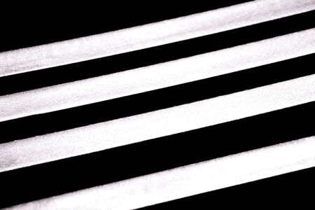 abstract strip of bright line with dark backgroundの写真素材
