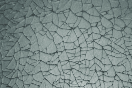 abstract crack of tempered glass on the stainless steel plate