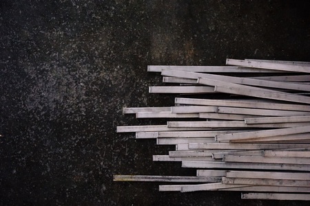 abstract of stainless steel slats on concrete floorの写真素材