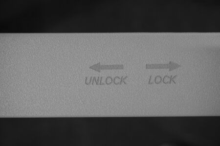 concept of lock and unlock word print on the metalの写真素材