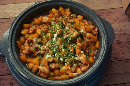 cooking of fried chicken with potatoの写真素材