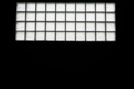 abstract of dirty square glass blocks on the factory wallの写真素材