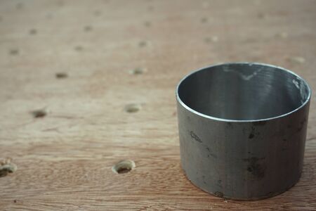 abstract of metal round tube on wood boardの写真素材