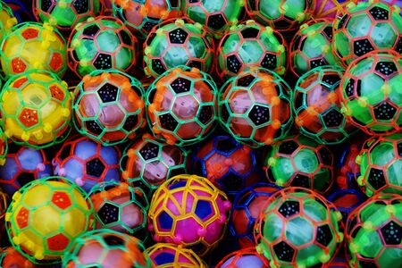 abstract mix of colorful plastic football toyの写真素材