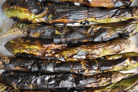Thai local cooking by grilled eggplant on the wood stoves in the countrysideの写真素材