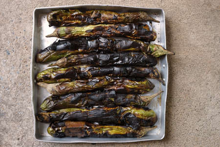 Thai local cooking by grilled eggplant on the wood stoves in the countrysideの写真素材