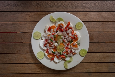 Hot and  tangy salad with salted eggs