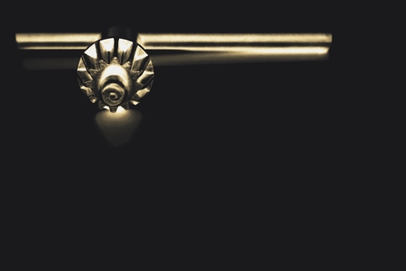 close up tighten the drill tool used to fit the drill in the drill machineの写真素材