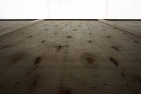 close up wood board with bright wall backgroundの写真素材