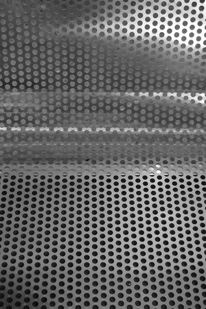 abstract of round metal mesh texture for background usedの写真素材