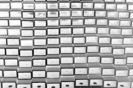 close up stack of square aluminum tube in factory
