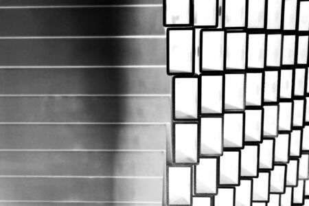close up stack of square aluminum tube in factoryの写真素材
