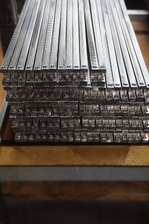 grop of metal stock with different size in warehouseの写真素材