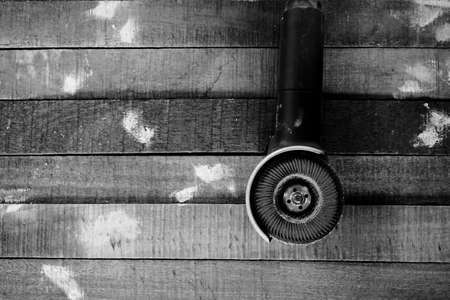 grinding machine tool on the wood board backgroundの写真素材