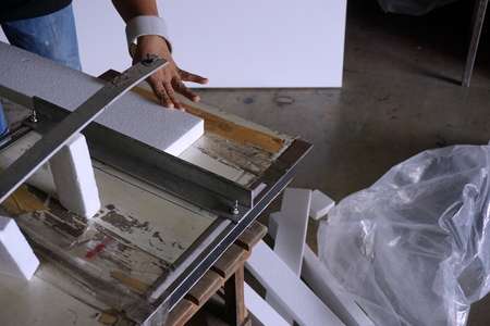 cutting foam machine use to cut the white foam in the shipping departmentの写真素材